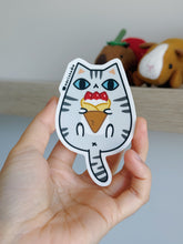 Light gray Tabby Cat with Strawberry Crepe Vinyl Sticker by Noristudio
