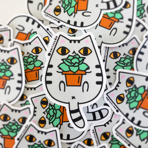 gray tabby cat with yellow eyes sticker by Noristudio