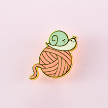 snail yarn ball pin by Noristudio
