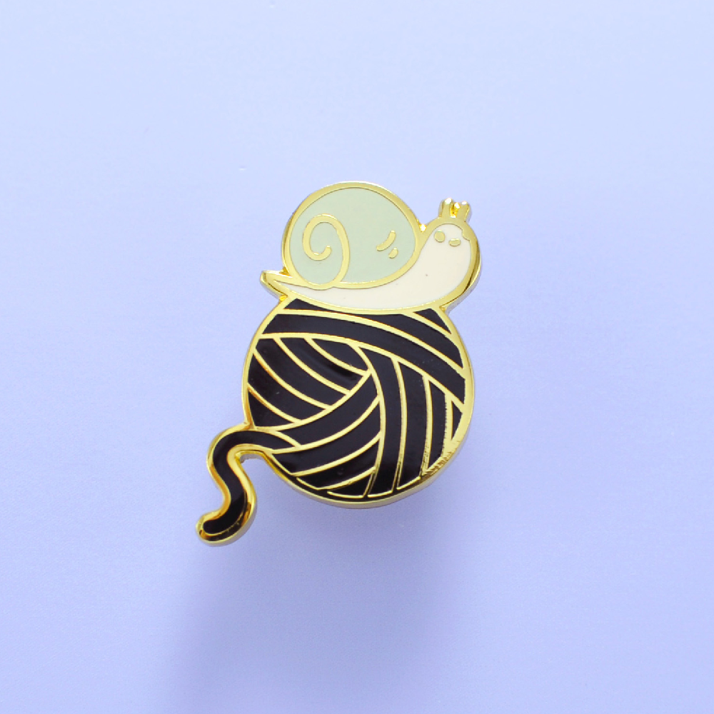 snail and yarn enamel pin by Noristudio